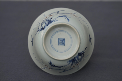 A Chinese blue, white and red on celadon ground 'prunus' bowl, Kangxi